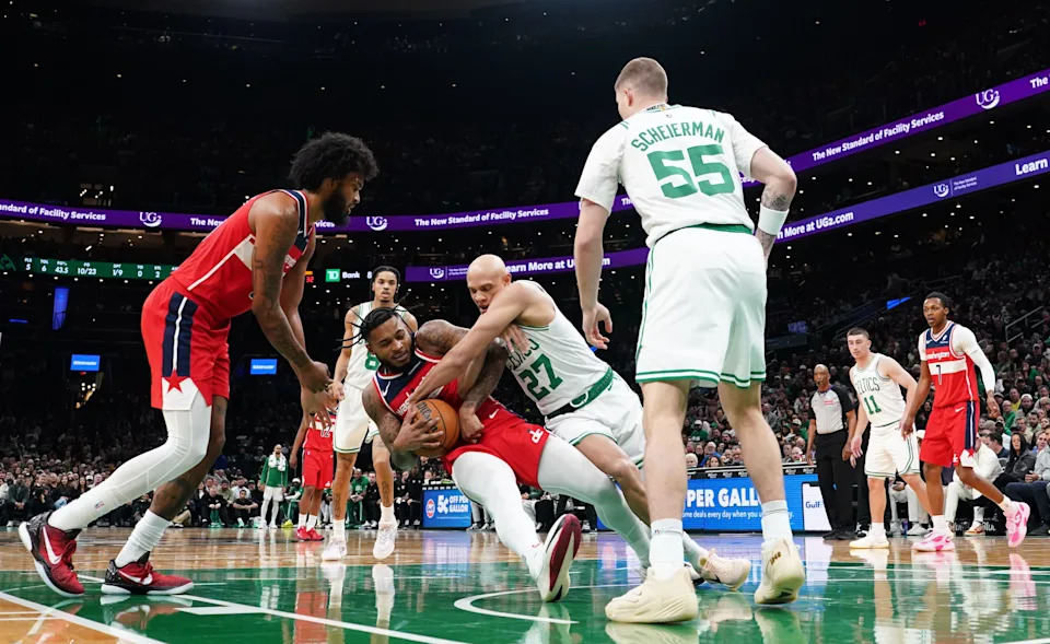 Nov 5, 2025; Boston, Massachusetts, USA; Washington Wizards forward Cam Whitmore (1) and Boston Celtics guard Jordan Walsh (27) work for there ball in the first quarter at TD Garden. Mandatory Credit: David Butler II-Imagn Images