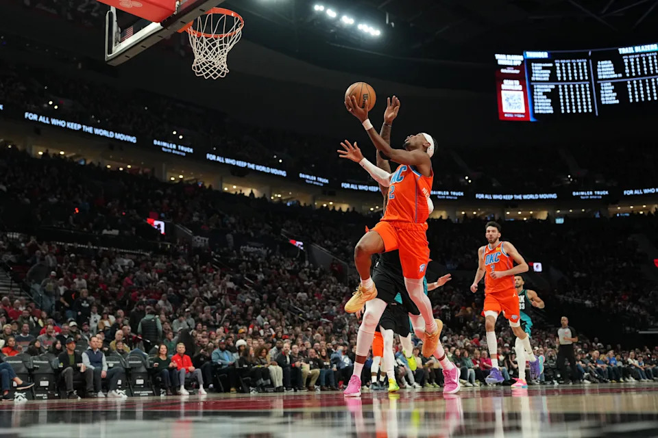 PORTLAND, OREGON - NOVEMBER 30: Shai Gilgeous-Alexander #2 of the Oklahoma City Thunder goes to the basket under pressure from Robert Williams III #35 of the Portland Trail Blazers during the second half at Moda Center on November 30, 2025 in Portland, Oregon. NOTE TO USER: User expressly acknowledges and agrees that, by downloading and or using this photograph, User is consenting to the terms and conditions of the Getty Images License Agreement. (Photo by Soobum Im/Getty Images)