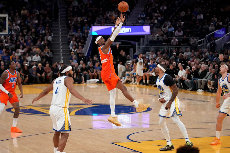 Dec 2, 2025; San Francisco, California, USA; Oklahoma City Thunder guard Shai Gilgeous-Alexander (2) shoots over Golden State Warriors guard Gary Payton II (0) in the third quarter at the Chase Center. Mandatory Credit: Cary Edmondson-Imagn Images