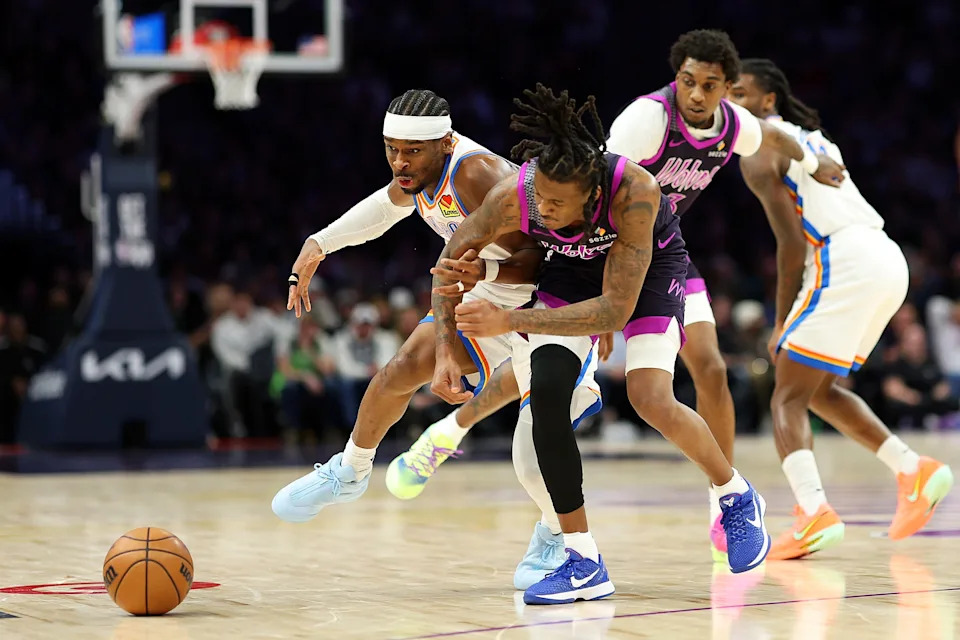 MINNEAPOLIS, MINNESOTA - DECEMBER 19: Bones Hyland #8 of the Minnesota Timberwolves fouls Shai Gilgeous-Alexander #2 of the Oklahoma City Thunder in the third quarter at Target Center on December 19, 2025 in Minneapolis, Minnesota. The Timberwolves defeated the Thunder 112-107. NOTE TO USER: User expressly acknowledges and agrees that, by downloading and or using this photograph, User is consenting to the terms and conditions of the Getty Images License Agreement. (Photo by David Berding/Getty Images)
