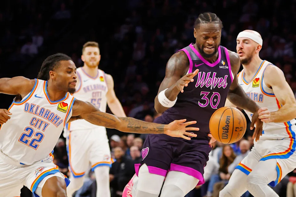 Dec 19, 2025; Minneapolis, Minnesota, USA; Oklahoma City Thunder guard Cason Wallace (22) knocks the ball from Minnesota Timberwolves forward Julius Randle (30) in the third quarter at Target Center. Mandatory Credit: Bruce Kluckhohn-Imagn Images