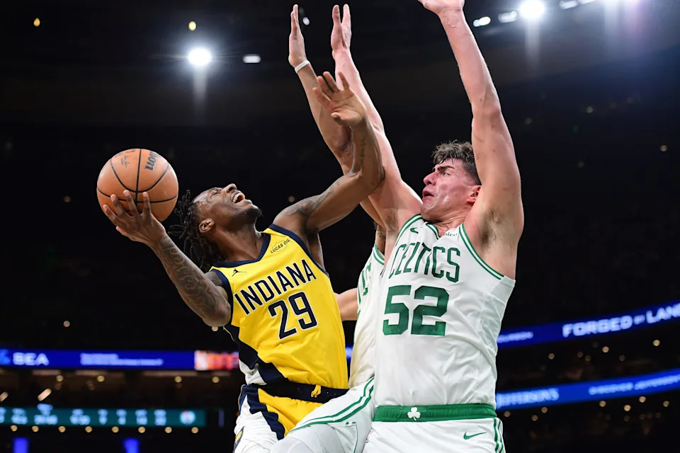 Dec 22, 2025; Boston, Massachusetts, USA; Indiana Pacers guard Quenton Jackson (29) gets fouled by Boston Celtics center Luka Garza (52) during the second half at TD Garden. Mandatory Credit: Bob DeChiara-Imagn Images