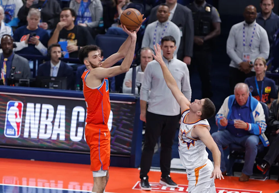 Dec 10, 2025; Oklahoma City, Oklahoma, USA; Oklahoma City Thunder center Chet Holmgren (7) shoots a three point basket as Phoenix Suns guard Grayson Allen (8) defends the shot during the first quarter at Paycom Center. Mandatory Credit: Alonzo Adams-Imagn Images