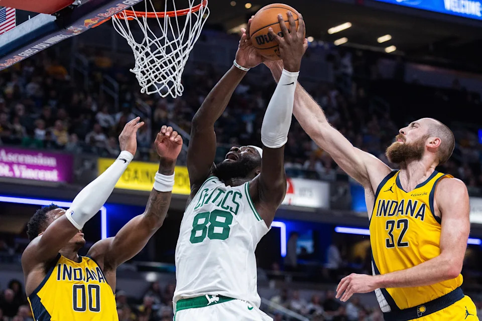 Dec 26, 2025; Indianapolis, Indiana, USA; Boston Celtics center Neemias Queta (88) shoots the ball while Indiana Pacers center Jay Huff (32) defends in the second half at Gainbridge Fieldhouse. Mandatory Credit: Trevor Ruszkowski-Imagn Images