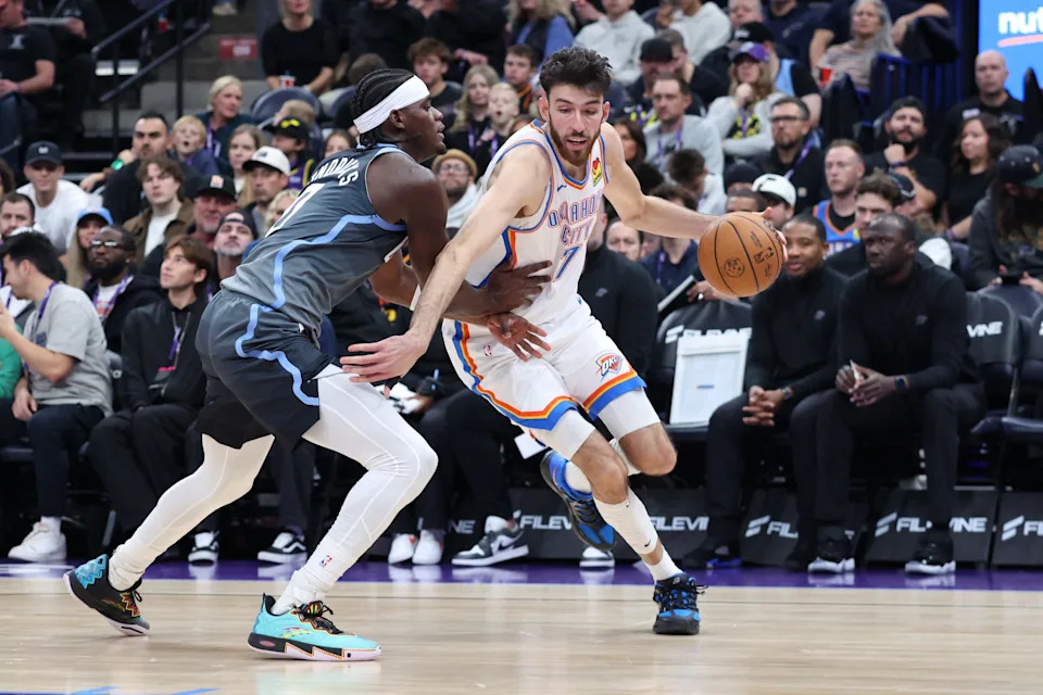 Dec 7, 2025; Salt Lake City, Utah, USA; Oklahoma City Thunder center Chet Holmgren (7) drives against Utah Jazz forward Taylor Hendricks (0) during the second quarter at Delta Center. Mandatory Credit: Rob Gray-Imagn Images
