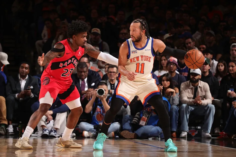 Jalen Brunson #11 of the New York Knicks handles the ball as Jamal Shead #23 of the Toronto Raptors plays defense during the game on November 30, 2025 at Madison Square Garden. NBAE via Getty Images