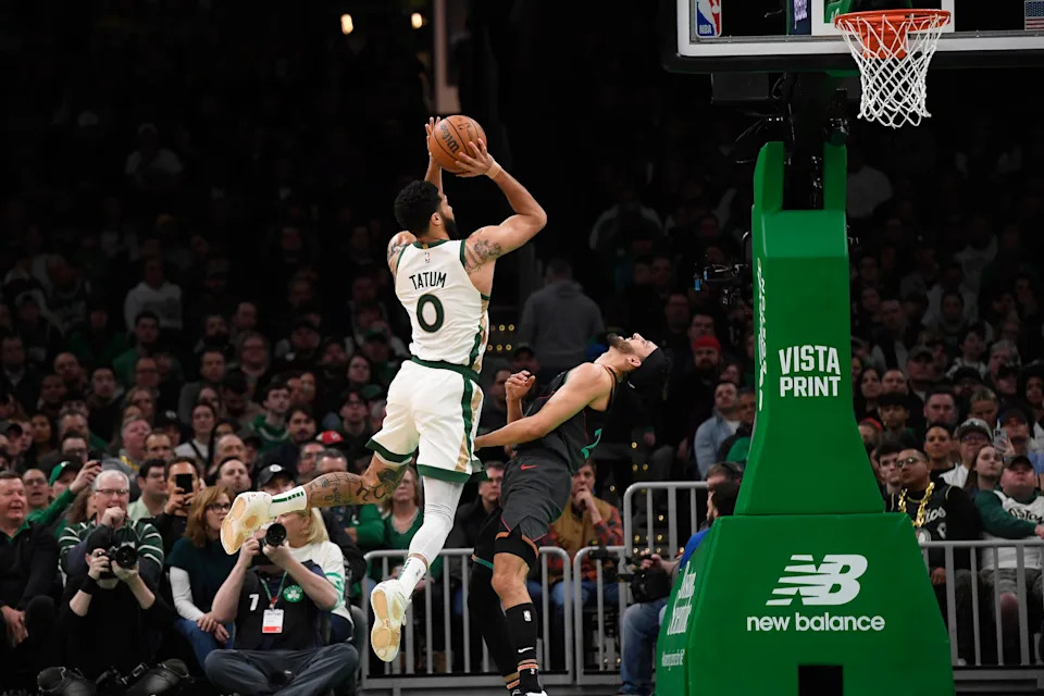 Feb 9, 2024; Boston, Massachusetts, USA; Boston Celtics forward Jayson Tatum (0) shoots the ball over Washington Wizards guard Landry Shamet (20) during the first half at TD Garden. Mandatory Credit: Bob DeChiara-USA TODAY Sports