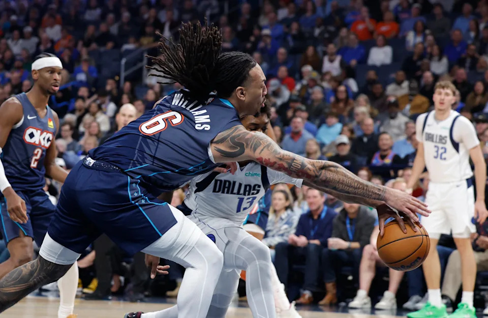 Dec 5, 2025; Oklahoma City, Oklahoma, USA; Oklahoma City Thunder forward Jaylin Williams (6) and Dallas Mavericks forward Naji Marshall (13) reach for a loose ball during the second quarter at Paycom Center. Mandatory Credit: Alonzo Adams-Imagn Images