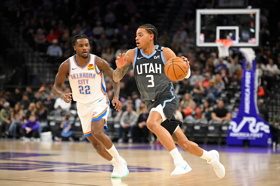 SALT LAKE CITY, UTAH - DECEMBER 07: Keyonte George #3 of the Utah Jazz drives past Cason Wallace #22 of the Oklahoma City Thunder during the first half of a game at Delta Center on December 07, 2025 in Salt Lake City, Utah. NOTE TO USER: User expressly acknowledges and agrees that, by downloading and or using this photograph, User is consenting to the terms and conditions of the Getty Images License Agreement. (Photo by Alex Goodlett/Getty Images)