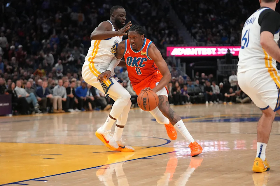 Dec 2, 2025; San Francisco, California, USA; Oklahoma City Thunder guard Jalen Williams (8) dribbles past Golden State Warriors forward Draymond Green (23) in the fourth quarter at the Chase Center. Mandatory Credit: Cary Edmondson-Imagn Images