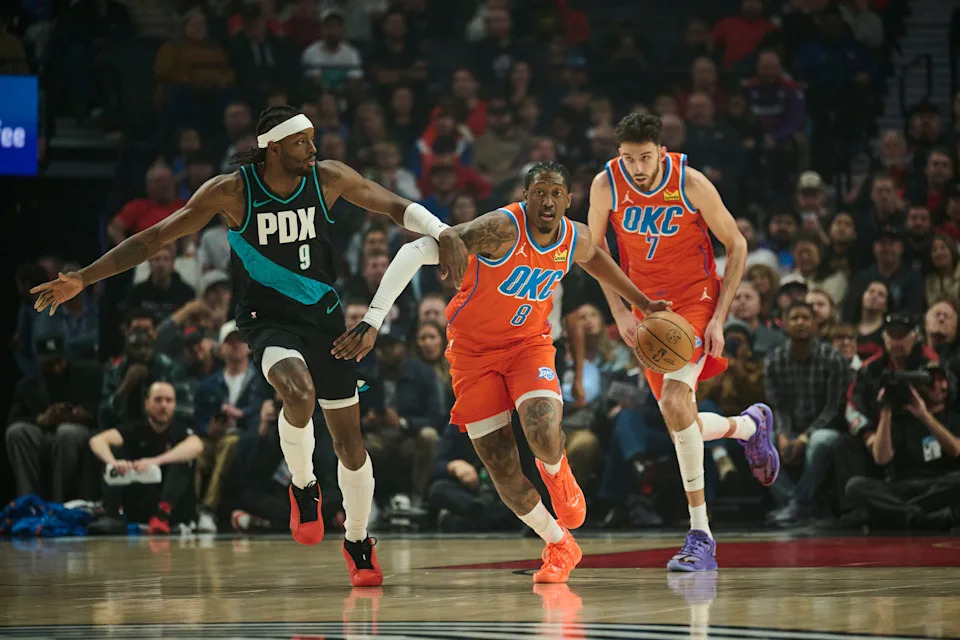 Nov 30, 2025; Portland, Oregon, USA; Oklahoma City Thunder guard Jalen Williams (8) dribbles the basketball during the first half against Portland Trail Blazers forward Jerami Grant (9) at Moda Center. Mandatory Credit: Troy Wayrynen-Imagn Images