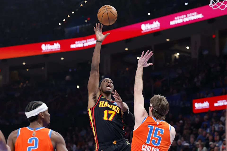 Dec 29, 2025; Oklahoma City, Oklahoma, USA; Atlanta Hawks forward Onyeka Okongwu (17) shoots over Oklahoma City Thunder center Branden Carlson (15) during the first half at Paycom Center. Mandatory Credit: Alonzo Adams-Imagn Images