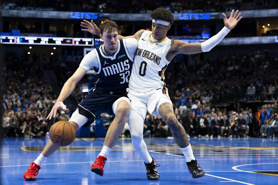 DALLAS, TEXAS – NOVEMBER 21: Cooper Flagg #32 of the Dallas Mavericks drives past Jeremiah Fears #0 of the New Orleans Pelicans in the second half of a Emirates NBA Cup game at American Airlines Center on November 21, 2025 in Dallas, Texas. NOTE TO USER: User expressly acknowledges and agrees that, by downloading and or using this photograph, User is consenting to the terms and conditions of the Getty Images License Agreement. (Photo by Gunnar Word/Getty Images)