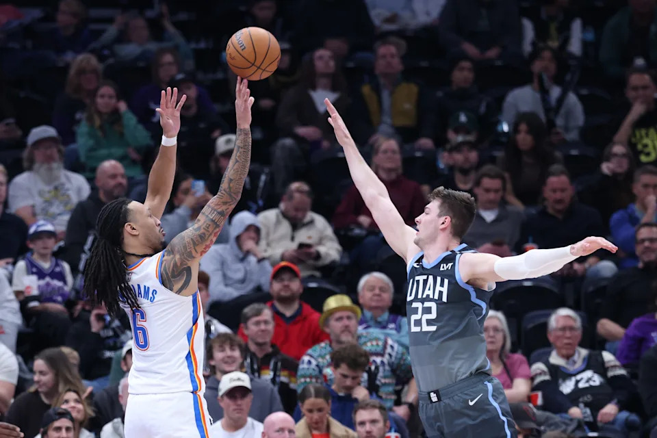 Dec 7, 2025; Salt Lake City, Utah, USA; Oklahoma City Thunder forward Jaylin Williams (6) shoots over Utah Jazz forward Kyle Filipowski (22) during the second half at Delta Center. Mandatory Credit: Rob Gray-Imagn Images
