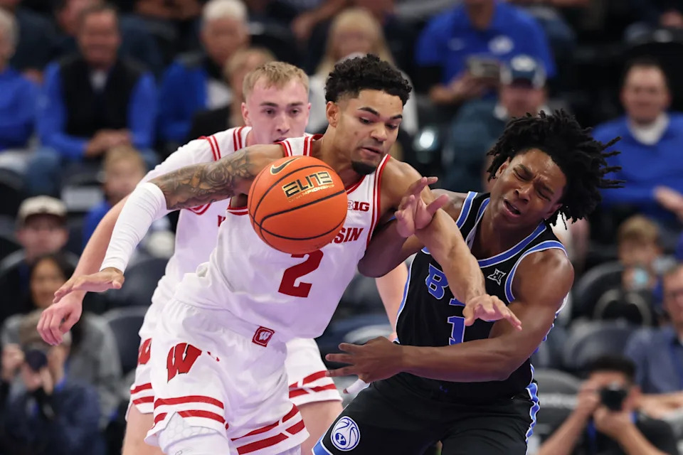 Wisconsin Badgers guard Nick Boyd (2) steals the ball from BYU Cougars guard Robert Wright III (1) during the first half at Delta Center in Salt Lake City, Utah.