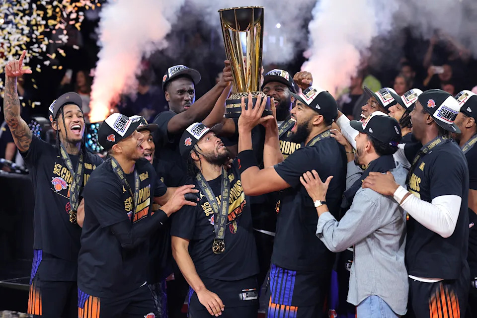 LAS VEGAS, NEVADA - DECEMBER 16: The New York Knicks celebrate with the trophy after the Knicks defeated the San Antonio Spurs 124-113 in the Emirates NBA Cup Championship game at T-Mobile Arena on December 16, 2025 in Las Vegas, Nevada.  (Photo by Ethan Miller/Getty Images)