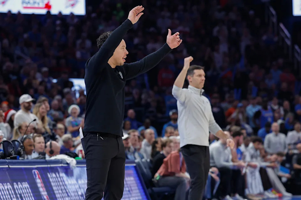 Dec 25, 2025; Oklahoma City, Oklahoma, USA; San Antonio Spurs head coach Mitch Johnson and Oklahoma City Thunder head coach Mark Daigneault gesture to their teams during the second half at Paycom Center. Mandatory Credit: Alonzo Adams-Imagn Images