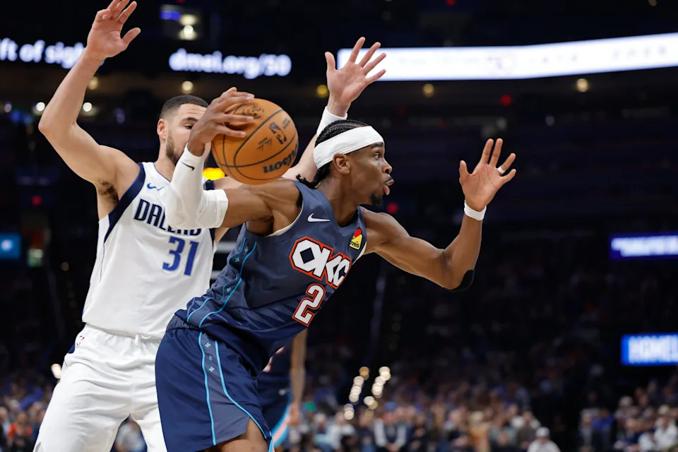 Dec 5, 2025; Oklahoma City, Oklahoma, USA; Oklahoma City Thunder guard Shai Gilgeous-Alexander (2) moves the ball past Dallas Mavericks guard Klay Thompson (31) during the second half at Paycom Center. Mandatory Credit: Alonzo Adams-Imagn Images