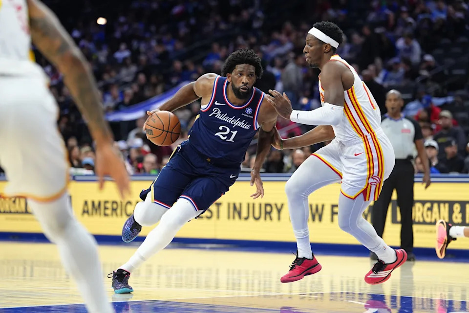 Nov 30, 2025; Philadelphia, Pennsylvania, USA; Philadelphia 76ers center Joel Embiid (21) drives against Atlanta Hawks forward Onyeka Okongwu (17) in the third quarter at Xfinity Mobile Arena. Mandatory Credit: Kyle Ross-Imagn Images