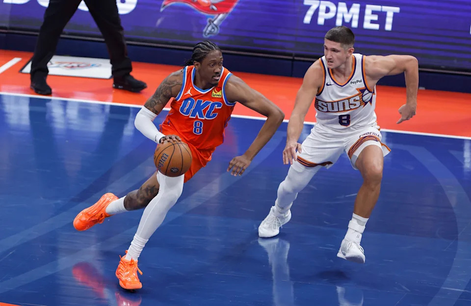 Dec 10, 2025; Oklahoma City, Oklahoma, USA; Oklahoma City Thunder guard Jalen Williams (8) drives past Phoenix Suns guard Grayson Allen (8) during the first quarter at Paycom Center. Mandatory Credit: Alonzo Adams-Imagn Images