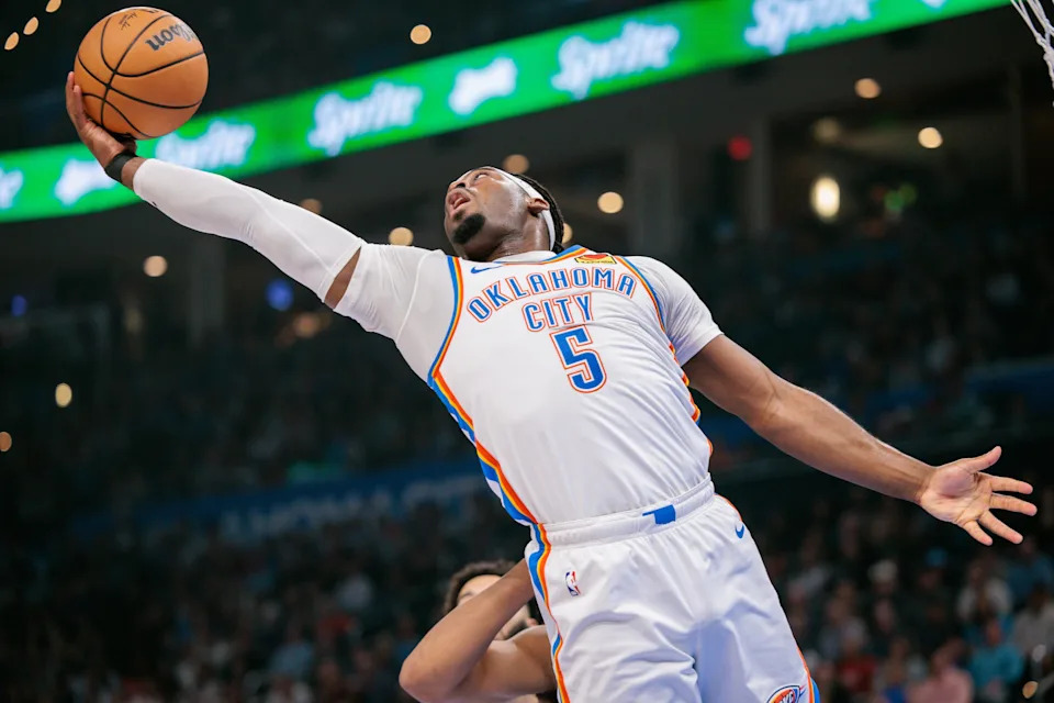 OKLAHOMA CITY, OKLAHOMA - DECEMBER 25: Luguentz Dort #5 of the Oklahoma City Thunder rebounds during the first half against the San Antonio Spurs at Paycom Center on December 25, 2025 in Oklahoma City, Oklahoma. NOTE TO USER: User expressly acknowledges and agrees that, by downloading and or using this photograph, User is consenting to the terms and conditions of the Getty Images License Agreement. (Photo by William Purnell/Getty Images)