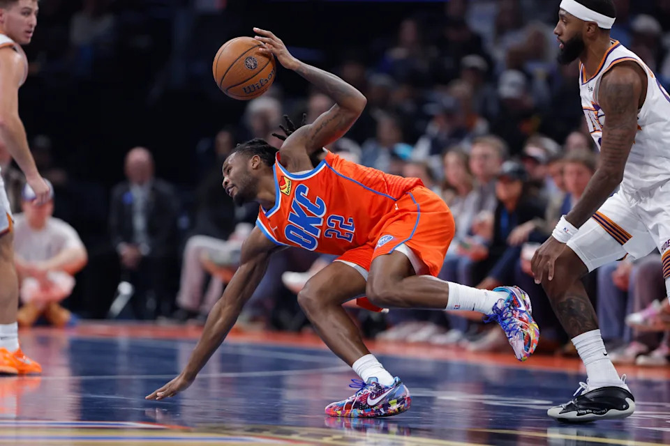 Dec 10, 2025; Oklahoma City, Oklahoma, USA; Oklahoma City Thunder guard Cason Wallace (22) works to control the ball during a drive against the Phoenix Suns during the second quarter at Paycom Center. Mandatory Credit: Alonzo Adams-Imagn Images