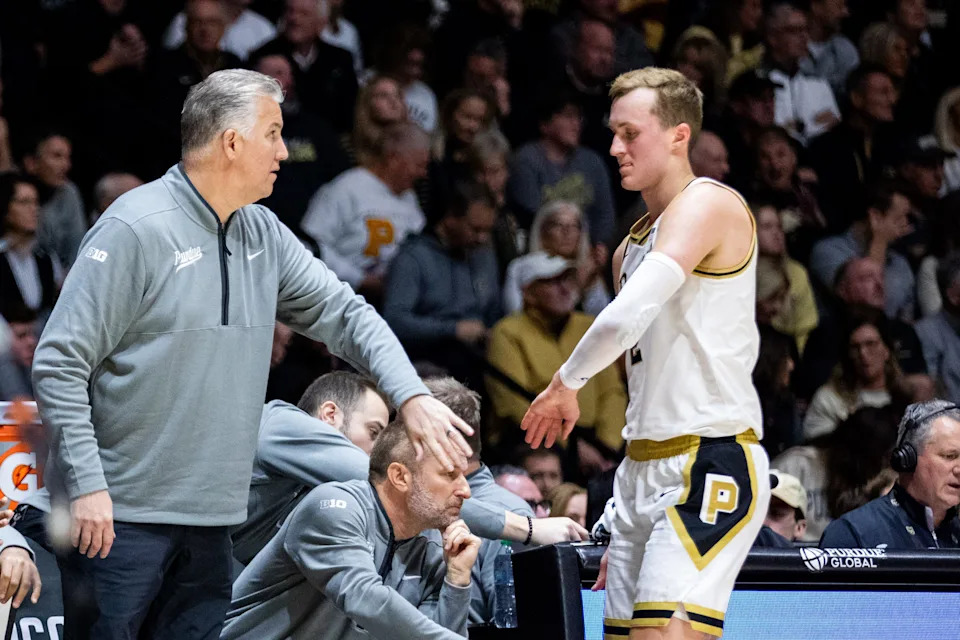 Purdue coach Matt Painter, left, greets Fletcher Loyer coming off the bench during a men's college basketball game against Iowa State Saturday, Dec. 6, 2025, at Mackey Arena in West Lafayette, Indiana.