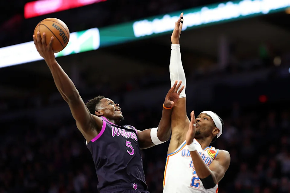 MINNEAPOLIS, MINNESOTA - DECEMBER 19: Anthony Edwards #5 of the Minnesota Timberwolves goes up for a shot against Shai Gilgeous-Alexander #2 of the Oklahoma City Thunder in the first quarter at Target Center on December 19, 2025 in Minneapolis, Minnesota. NOTE TO USER: User expressly acknowledges and agrees that, by downloading and or using this photograph, User is consenting to the terms and conditions of the Getty Images License Agreement. (Photo by David Berding/Getty Images)