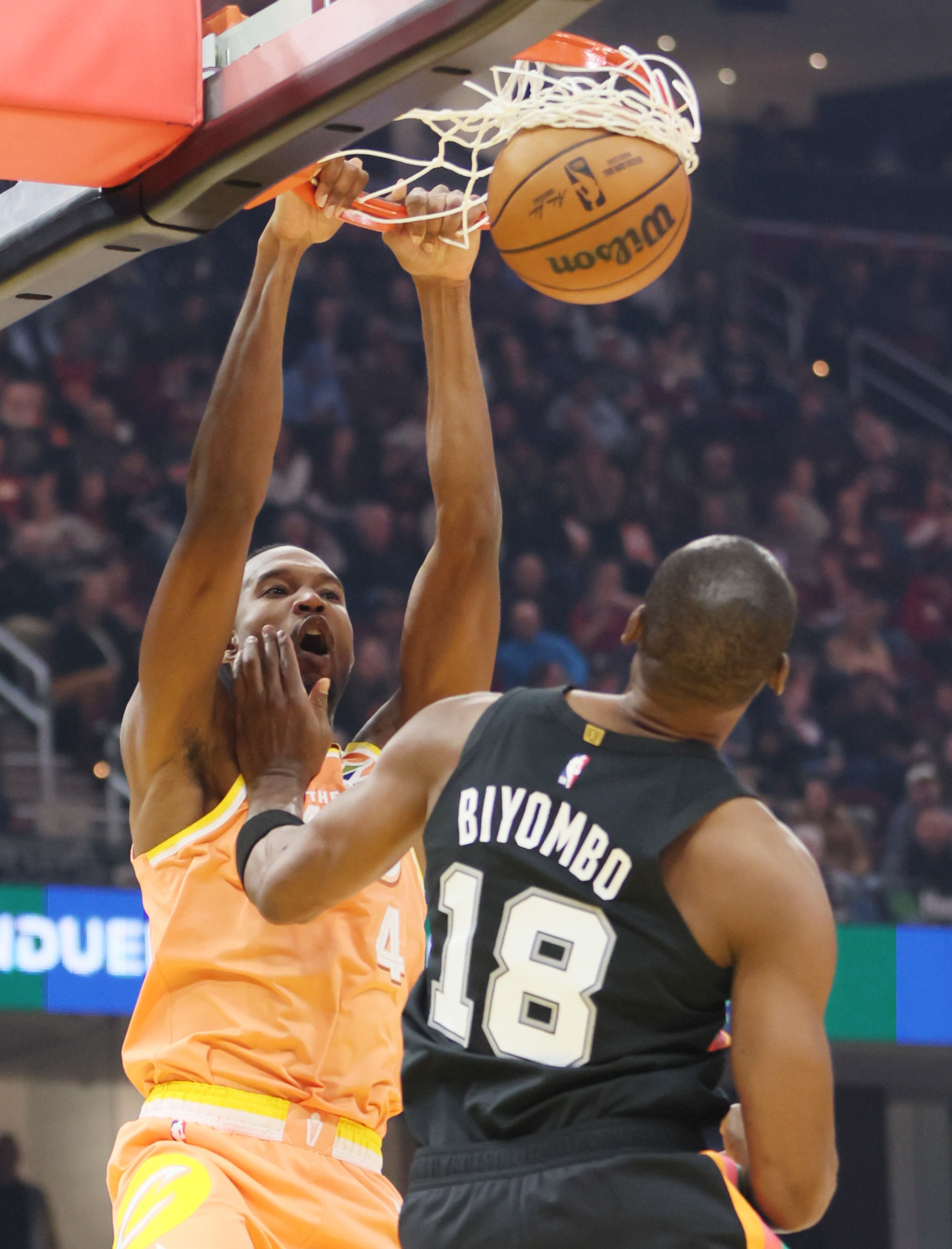 Cleveland Cavaliers center Evan Mobley dunks the ball guarded by San Antonio Spurs center Bismack Biyombo in the first half at Rocket Arena. 