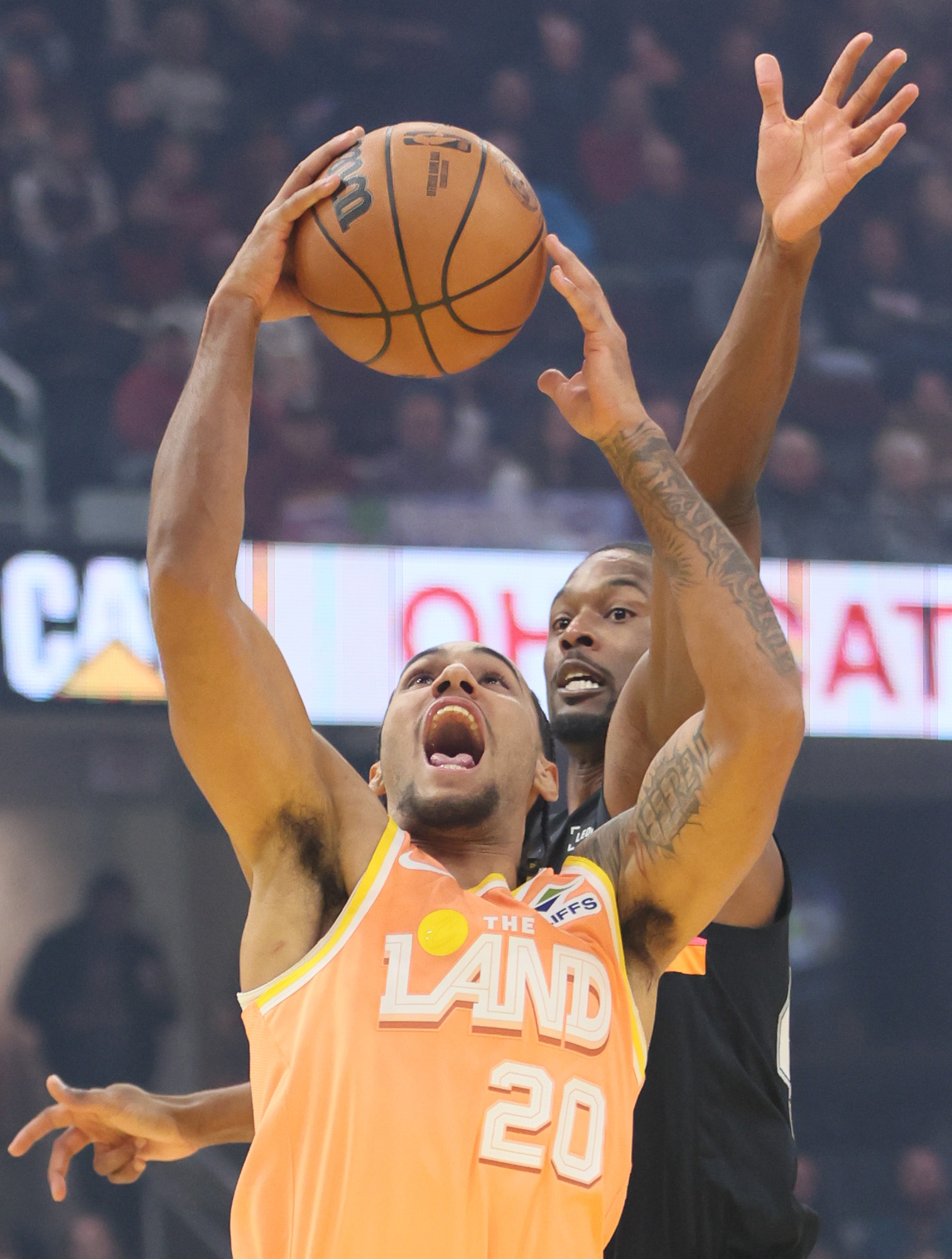 Cleveland Cavaliers guard Jaylon Tyson goes up for a shot attempt guarded by San Antonio Spurs forward Harrison Barnes in the first half at Rocket Arena. 