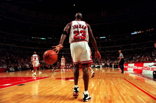 The Chicago Bulls' Michael Jordan heads up court during a game at the United Center on Dec. 15, 1998. (Chicago Tribune)
