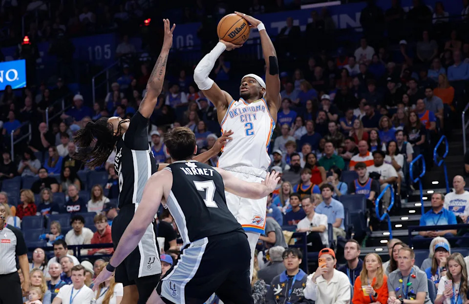 Dec 25, 2025; Oklahoma City, Oklahoma, USA; Oklahoma City Thunder guard Shai Gilgeous-Alexander (2) shoots against the San Antonio Spurs during the second half at Paycom Center. Mandatory Credit: Alonzo Adams-Imagn Images