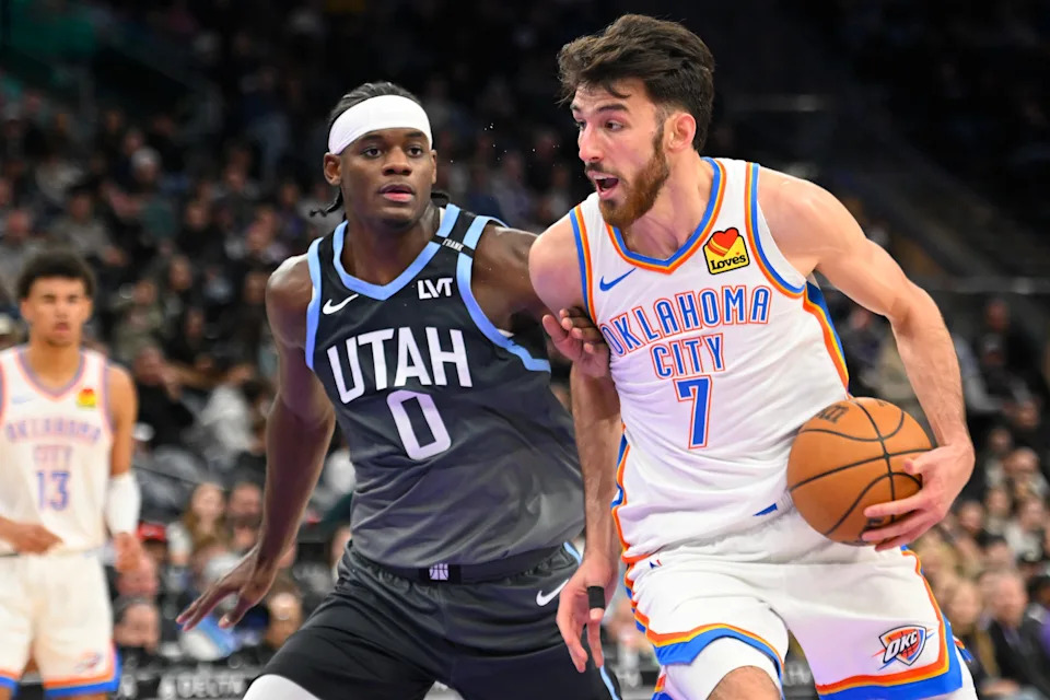 SALT LAKE CITY, UTAH - DECEMBER 07: Chet Holmgren #7 of the Oklahoma City Thunder drives into Taylor Hendricks #0 of the Utah Jazz during the second half of a game at Delta Center on December 07, 2025 in Salt Lake City, Utah. NOTE TO USER: User expressly acknowledges and agrees that, by downloading and or using this photograph, User is consenting to the terms and conditions of the Getty Images License Agreement. (Photo by Alex Goodlett/Getty Images)