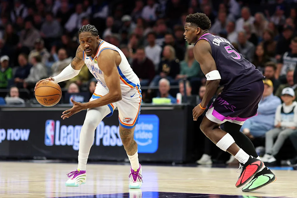 MINNEAPOLIS, MINNESOTA - DECEMBER 19: Jalen Williams #8 of the Oklahoma City Thunder drives to the basket against Anthony Edwards #5 of the Minnesota Timberwolves in the fourth quarter at Target Center on December 19, 2025 in Minneapolis, Minnesota. The Timberwolves defeated the Thunder 112-107. NOTE TO USER: User expressly acknowledges and agrees that, by downloading and or using this photograph, User is consenting to the terms and conditions of the Getty Images License Agreement. (Photo by David Berding/Getty Images)