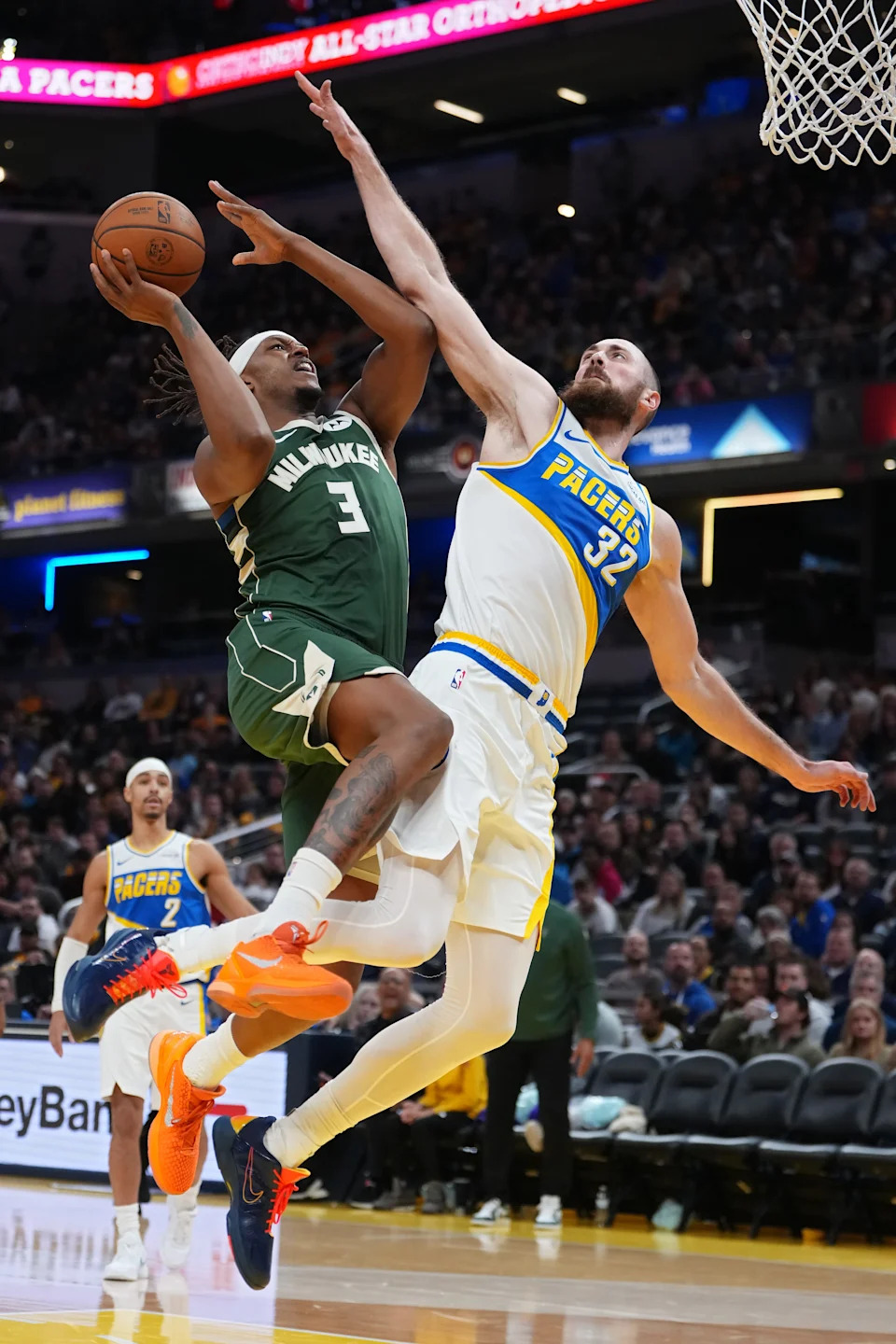 Bucks center Myles Turner attempts a shot while being guarded by Jay Huff of the Pacers during the second quarter Dec. 23 at Gainbridge Fieldhouse in Indianapolis.