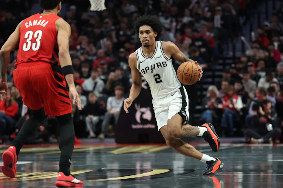 San Antonio Spurs guard Dylan HarperNov 26&comma; 2025&semi; Portland&comma; Oregon&comma; USA&semi; San Antonio Spurs guard Dylan Harper &lpar;2&rpar; brings the ball up the court against Portland Trail Blazers forward Toumani Camara &lpar;33&rpar; in the second half at Moda Center&period; Mandatory Credit&colon; Jaime Valdez-Imagn Images