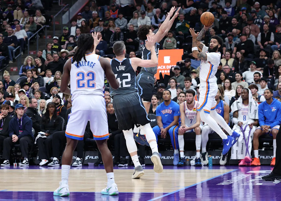 Dec 7, 2025; Salt Lake City, Utah, USA; Oklahoma City Thunder guard Kenrich Williams (34) leaps to save the ball from going out of bounds against the Utah Jazz during the second half at Delta Center. Mandatory Credit: Rob Gray-Imagn Images