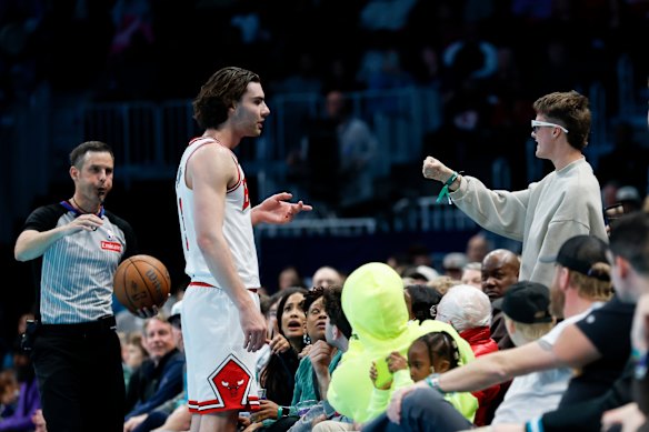 Close confrontation: Josh Giddey clashes with the fan, who was sitting close to the action.