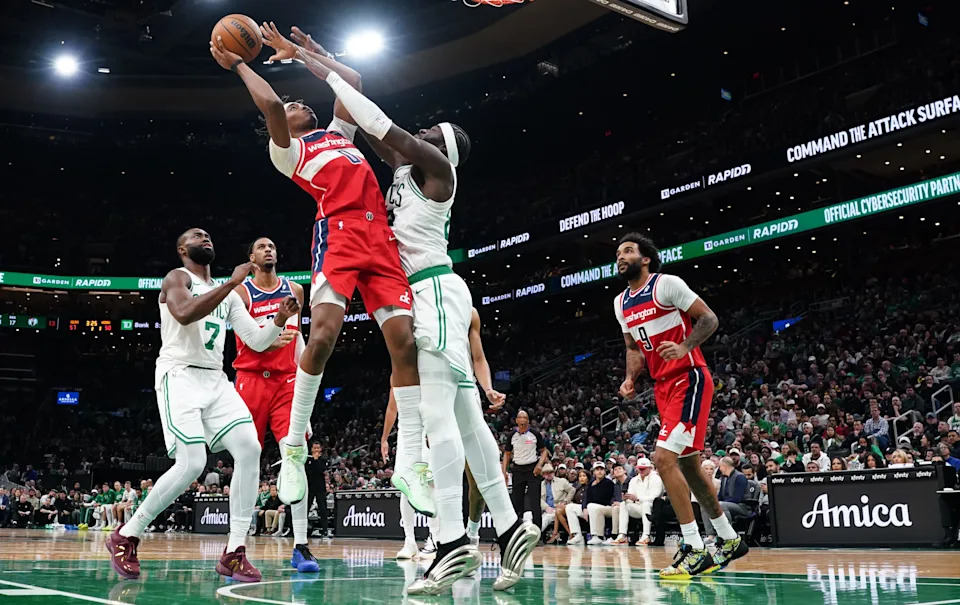 Nov 5, 2025; Boston, Massachusetts, USA; Boston Celtics center Neemias Queta (88) defend against Washington Wizards guard Bilal Coulibaly (0) in the second quarter at TD Garden. Mandatory Credit: David Butler II-Imagn Images