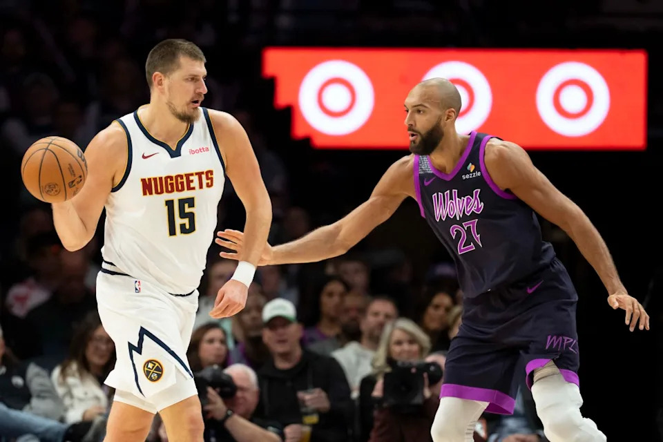 Denver Nuggets center Nikola Jokic passes the ball as Minnesota Timberwolves center Rudy GobertJesse Johnson-Imagn Images