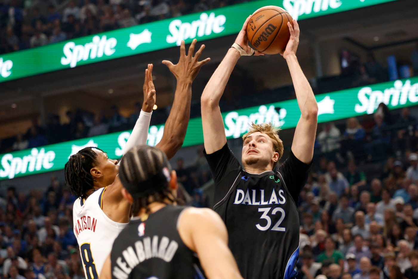 Dallas Mavericks forward Cooper Flagg (32) shoots the ball as Denver Nuggets guard Peyton...