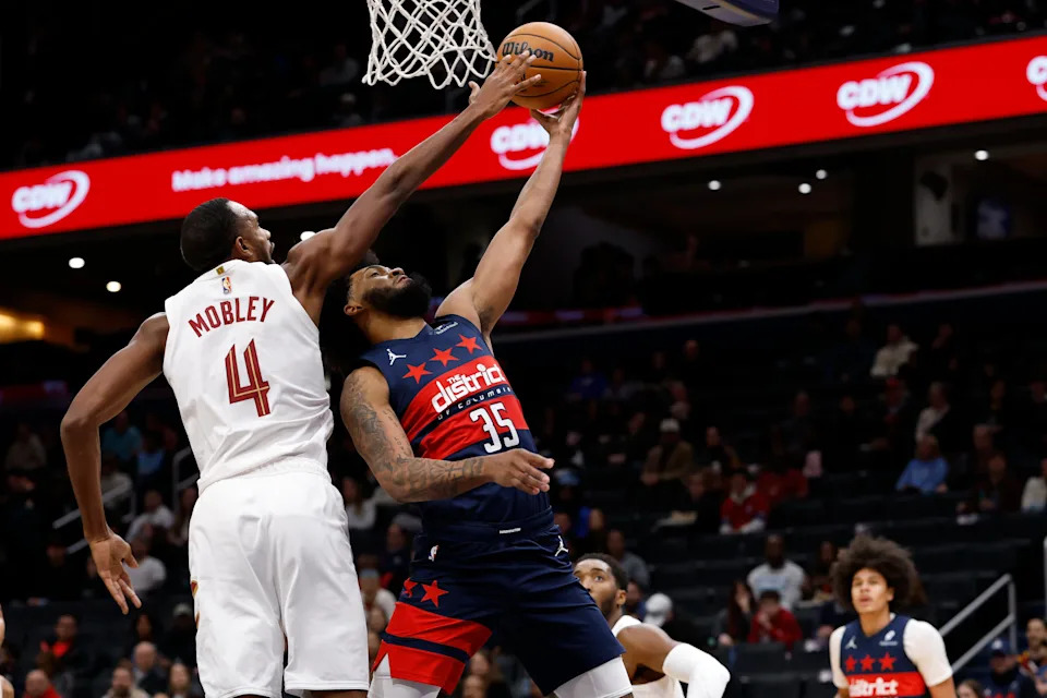 Dec 12, 2025; Washington, District of Columbia, USA; Washington Wizards forward Marvin Bagley III (35) has a shot blocked by Cleveland Cavaliers center Evan Mobley (4) in the first half at Capital One Arena. Mandatory Credit: Geoff Burke-Imagn Images