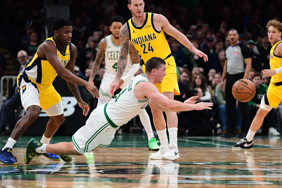 Dec 22, 2025; Boston, Massachusetts, USA; Boston Celtics guard Payton Pritchard (11) passes the ball during the second half against the Indiana Pacers at TD Garden. Mandatory Credit: Bob DeChiara-Imagn Images