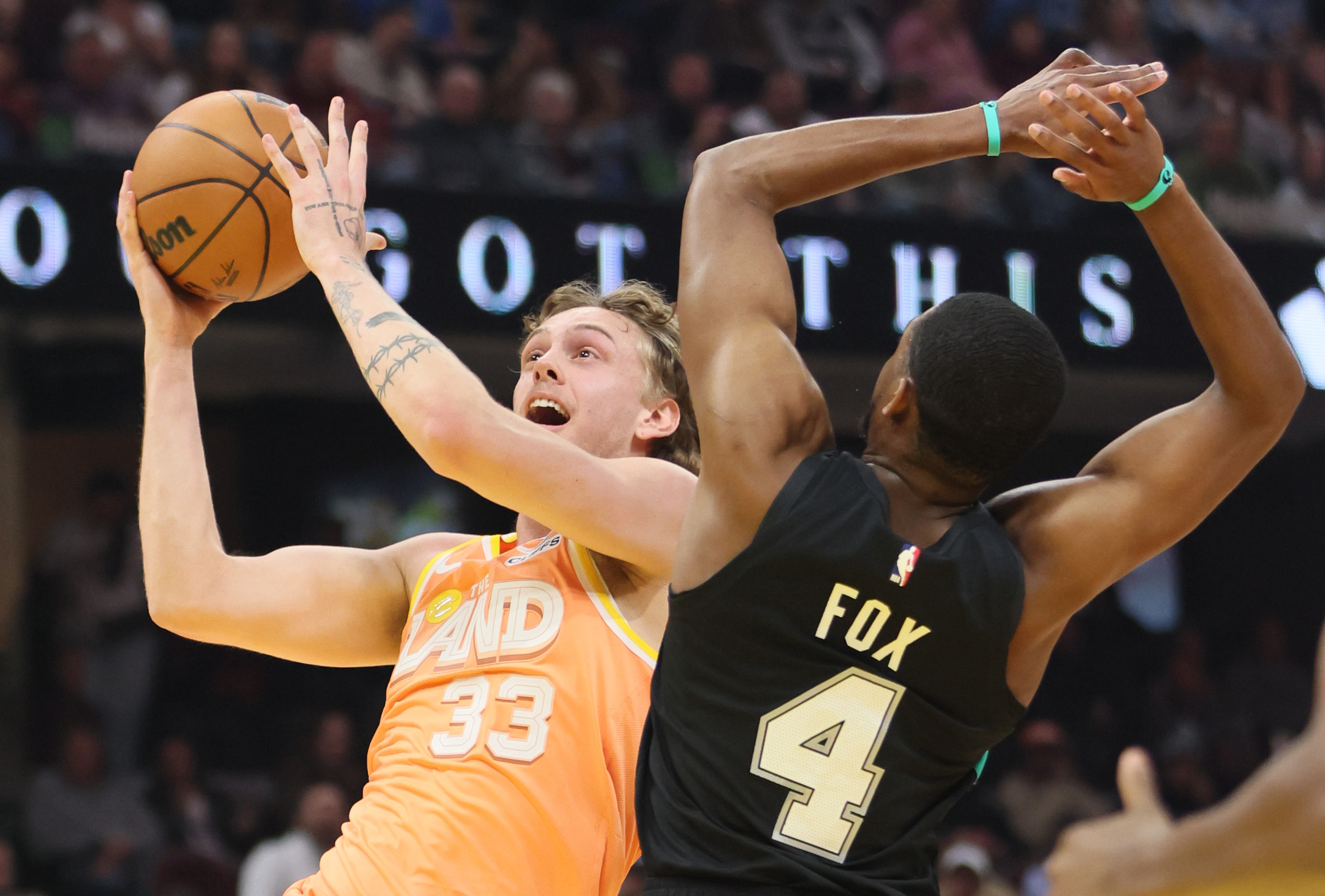 Cleveland Cavaliers forward Luke Travers drives to the basket guarded by San Antonio Spurs guard De'Aaron Fox in the first half at Rocket Arena. 