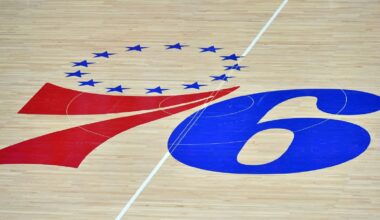 The Philadelphia 76ers logo at center court