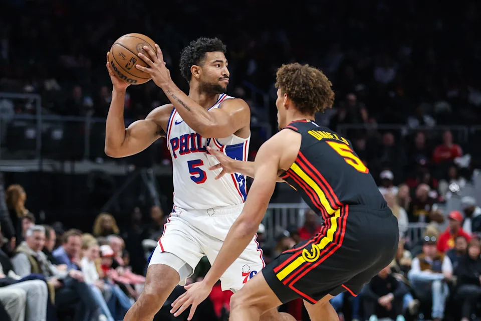 Dec 14, 2025; Atlanta, Georgia, USA; Philadelphia 76ers guard Quentin Grimes (5) looks to pass against Atlanta Hawks guard Dyson Daniels (5) during the first quarter at State Farm Arena. Mandatory Credit: Jordan Godfree-Imagn Images