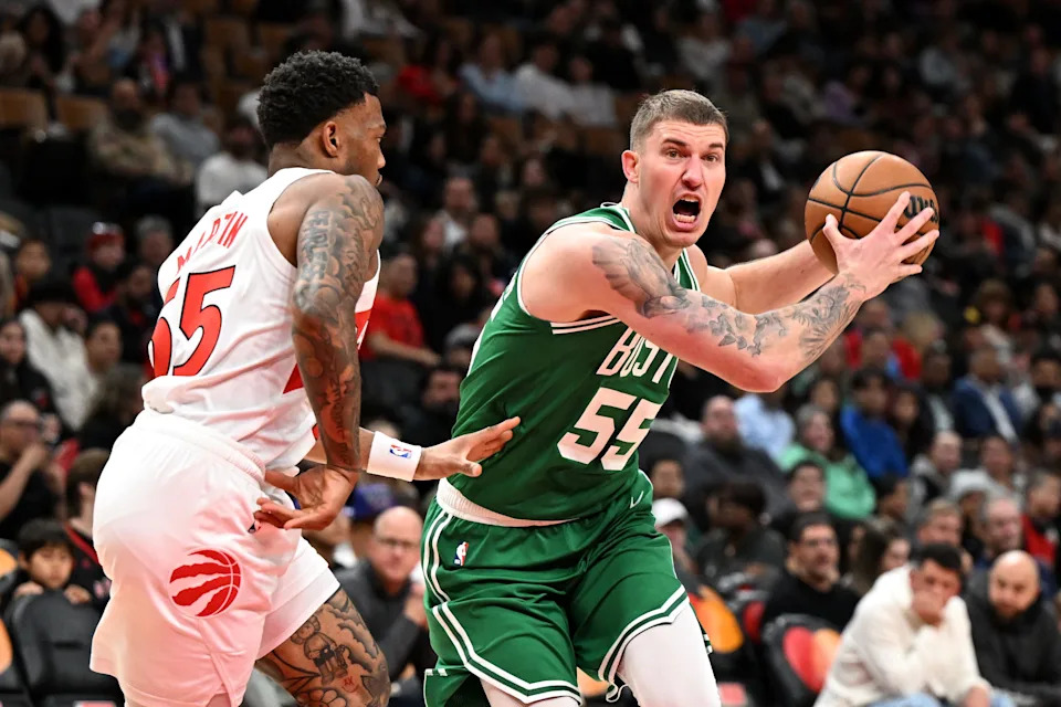 Oct 10, 2025; Toronto, Ontario, CAN; Boston Celtics forward Baylor Scheierman (55) moves the ball past Toronto Raptors guard Alijah Martin (55) in the first half at Scotiabank Arena. Mandatory Credit: Dan Hamilton-Imagn Images