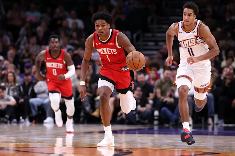 PHOENIX, ARIZONA - NOVEMBER 24: Amen Thompson #1 of the Houston Rockets dribbles the ball during the second half against the Phoenix Suns at Mortgage Matchup Center on November 24, 2025 in Phoenix, Arizona. NOTE TO USER: User expressly acknowledges and agrees that, by downloading and or using this photograph, User is consenting to the terms and conditions of the Getty Images License Agreement. (Photo by Chris Coduto/Getty Images)