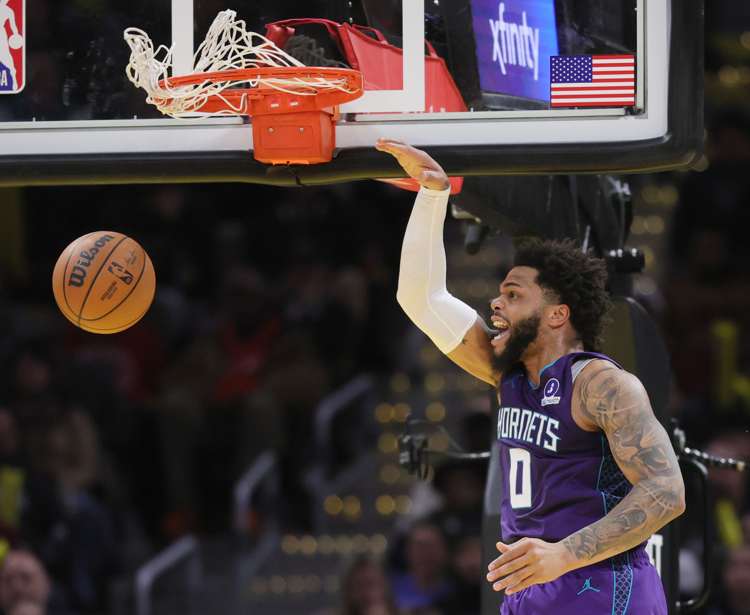 Charlotte Hornets forward Miles Bridges dunks the ball for a score in the second half at Rocket Arena.