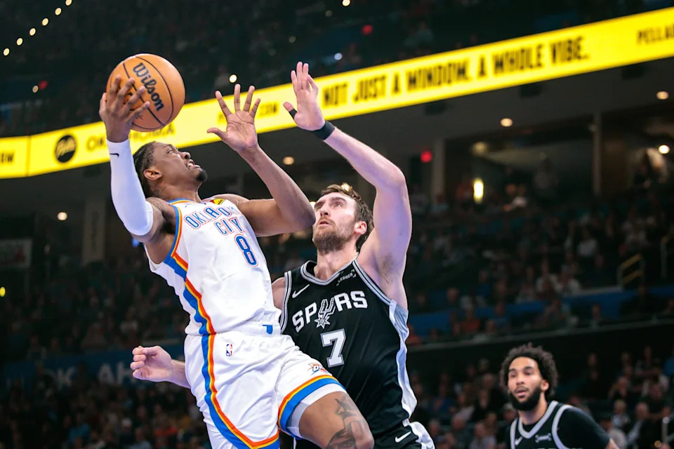 OKLAHOMA CITY, OKLAHOMA - DECEMBER 25: Jalen Williams #8 of the Oklahoma City Thunder shoots the ball over Luke Kornet #7 of the San Antonio Spurs during the first half at Paycom Center on December 25, 2025 in Oklahoma City, Oklahoma. NOTE TO USER: User expressly acknowledges and agrees that, by downloading and or using this photograph, User is consenting to the terms and conditions of the Getty Images License Agreement. (Photo by William Purnell/Getty Images)